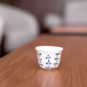 Desert Star White Teacup with Sporadic Blue Crosses